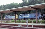 CSX SB freight with Conrail unit passing the passenger station